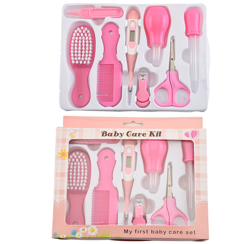 Pink baby care kit with various tools