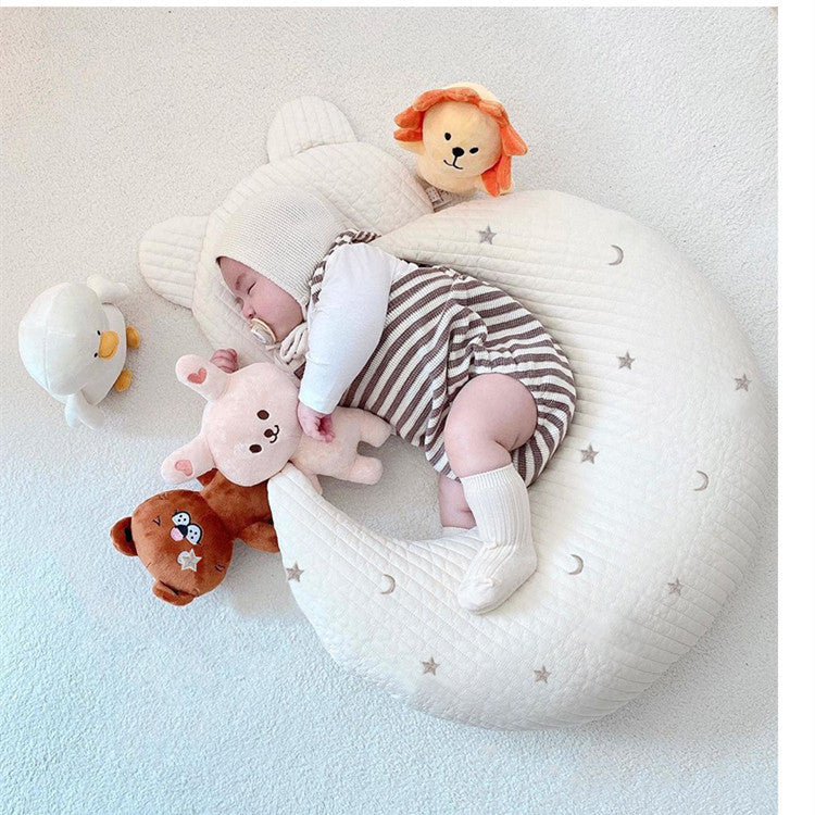 Nursery bed with moon pillow
