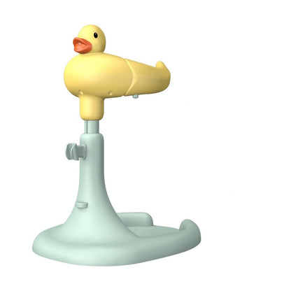 A yellow duck-shaped baby bath stand on a mint green adjustable pole with wide non-slip oval base is shown on a plain white background