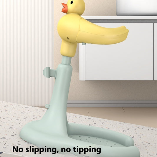 Yellow duck-shaped stand with text 'No slipping, no tipping' on a light background