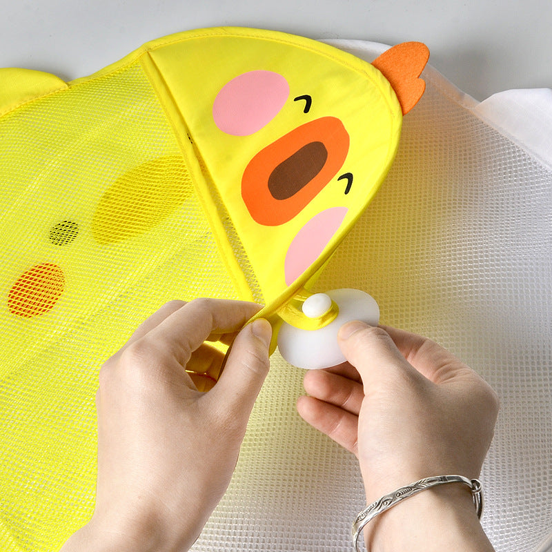 Hands attaching suction cup to duck baby bath toy mesh storage bag