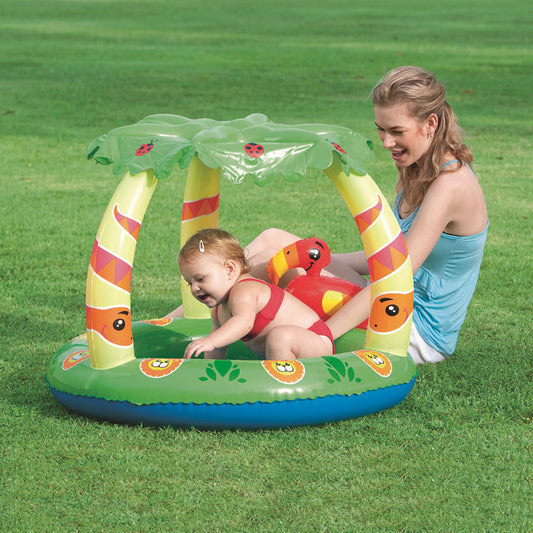 Inflatable pool with a canopy and toys 