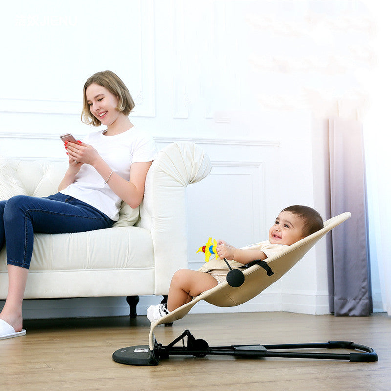 baby in a portable baby seat on the floor.