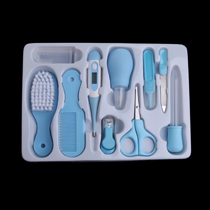Set of baby care tools, including a brush, comb, scissors,