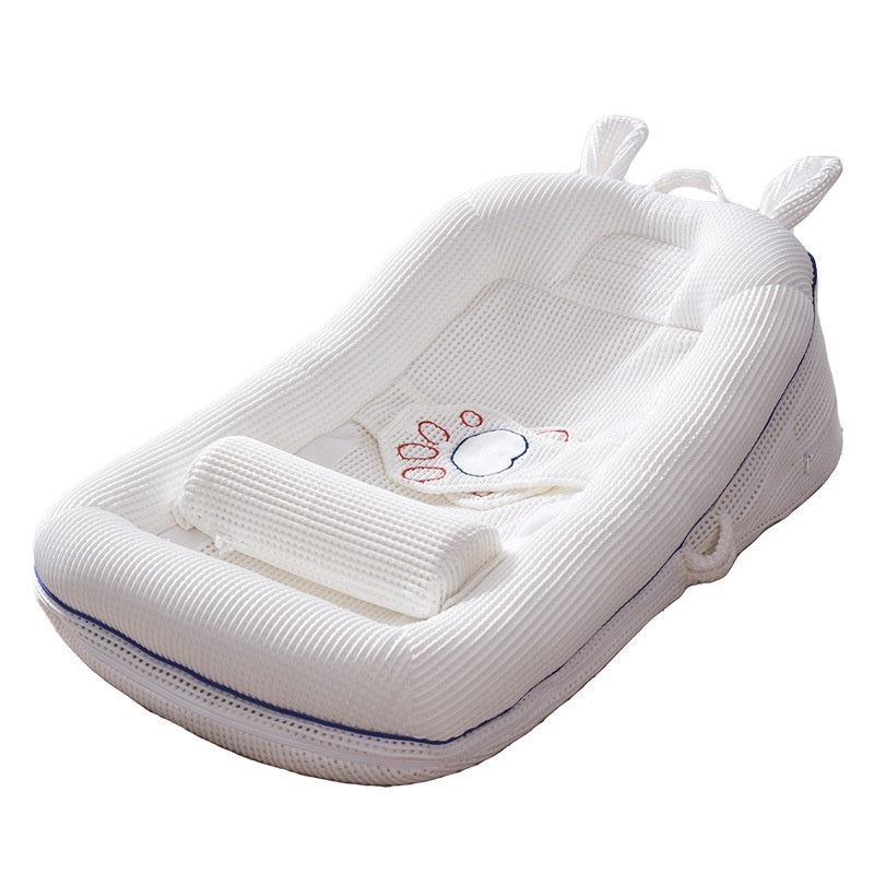 Cream newborn baby lounger bed with breathable side panels