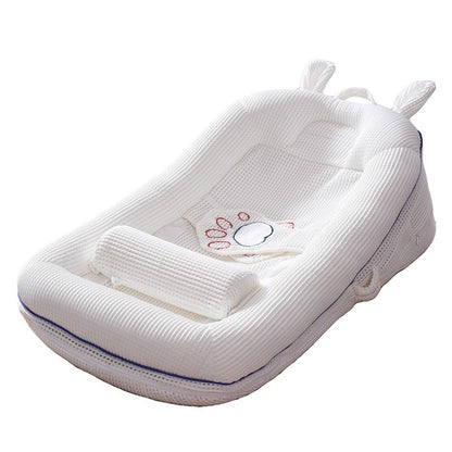 Cream newborn baby lounger bed with breathable side panels