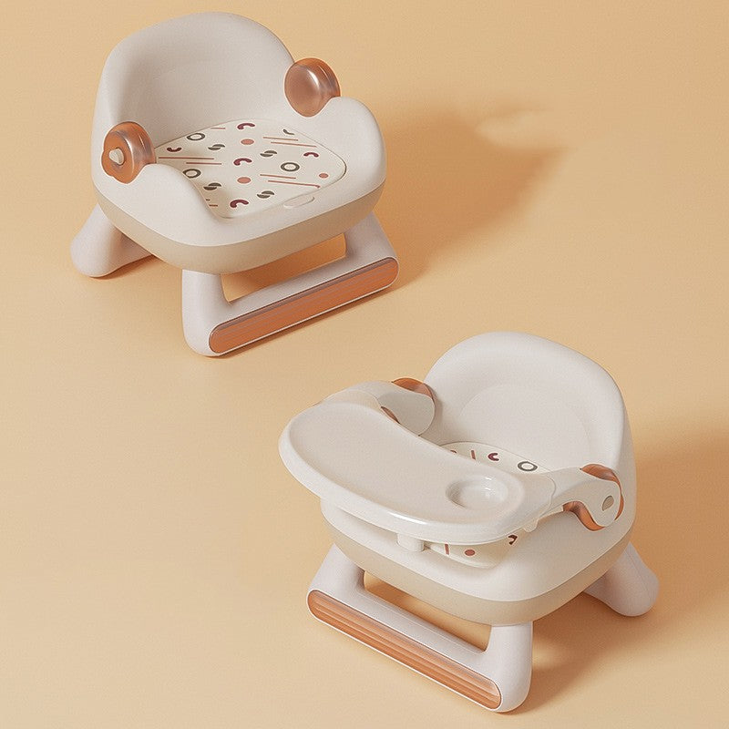Two baby bath seats with brown accents