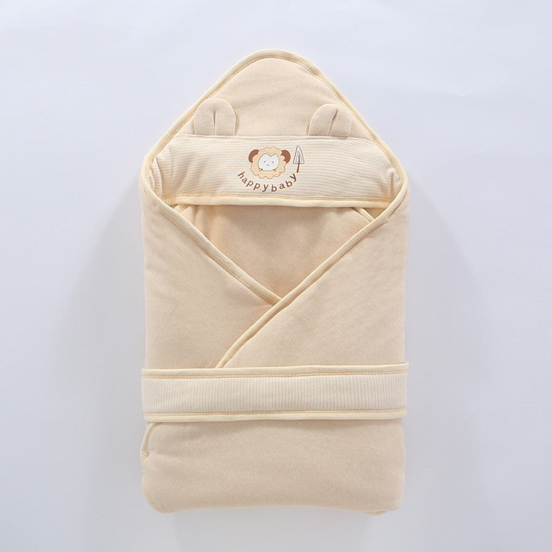 Newborn wrapped snugly in soft cotton swaddle wrap