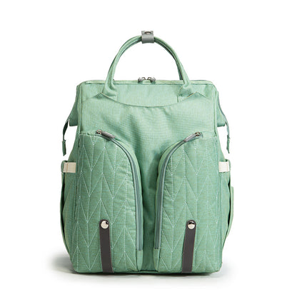 Diaper bag backpack packed with diapers, wipes, and bottles
