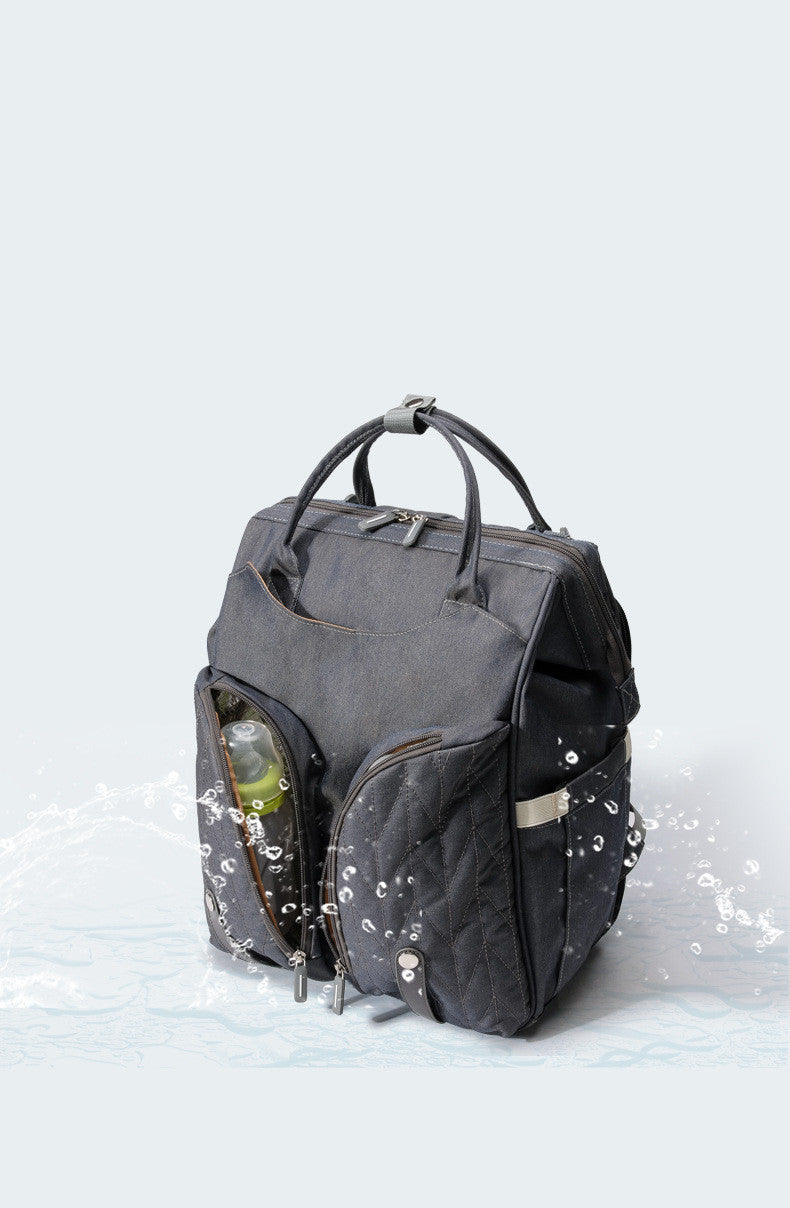  Foldable changing mat unfolded from diaper bag backpack
