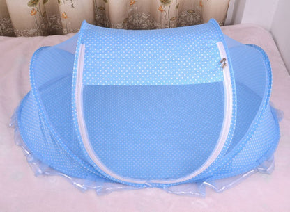 Newborn mosquito net tent set up on a flat surface 