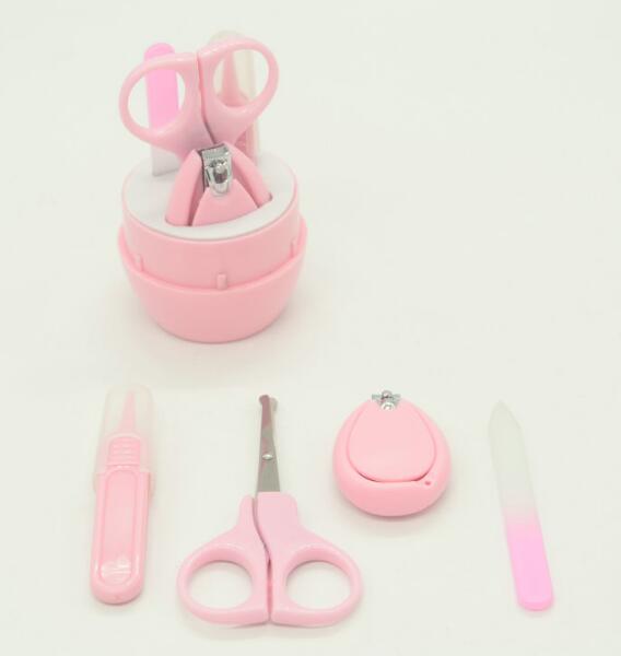 Pink grooming set with scissors, nail clippers.