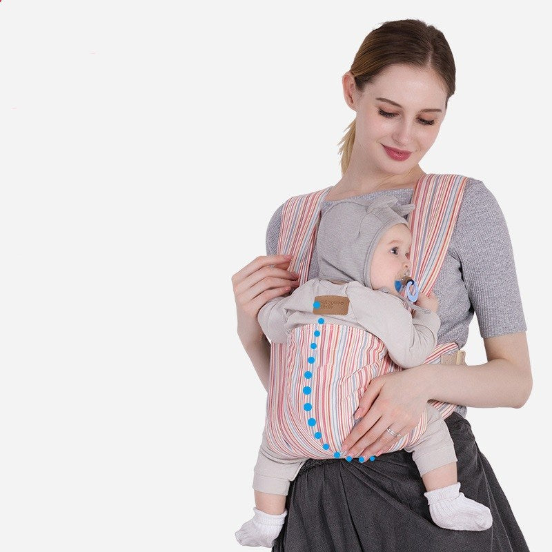  Mother wearing striped mesh baby carrier in front-carry position holding baby
