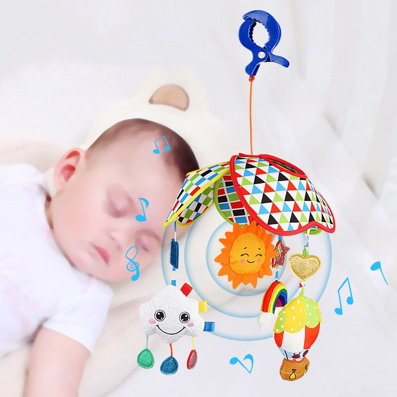 Musical crib toy hanging over sleeping baby