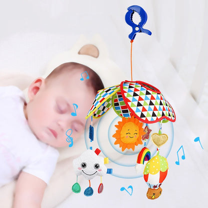 Musical crib toy hanging over sleeping baby