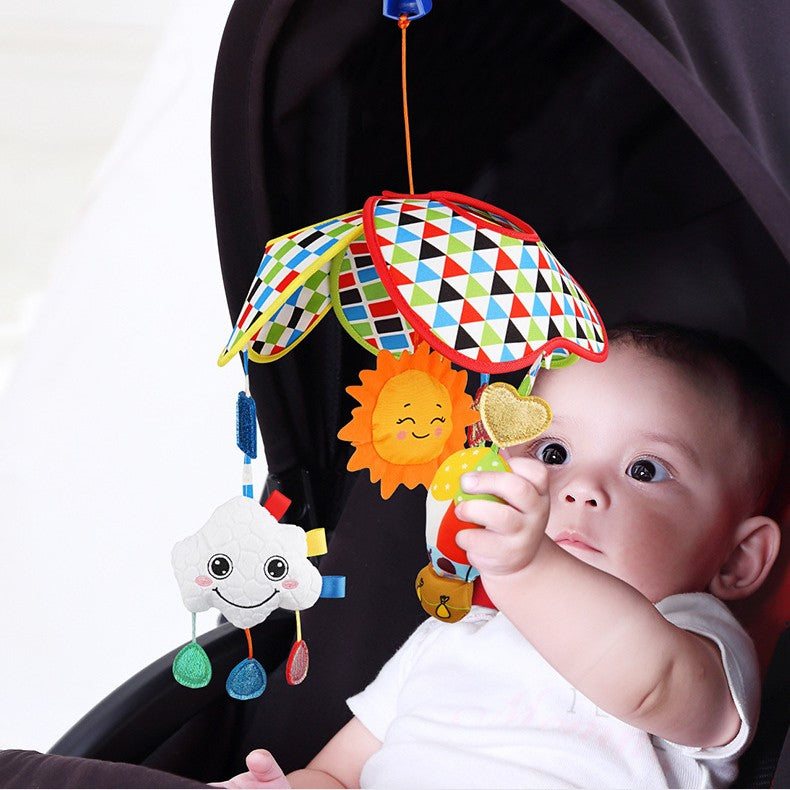 Musical stroller toy with baby reaching for it