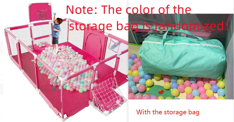 Baby playing in pink ball pit
