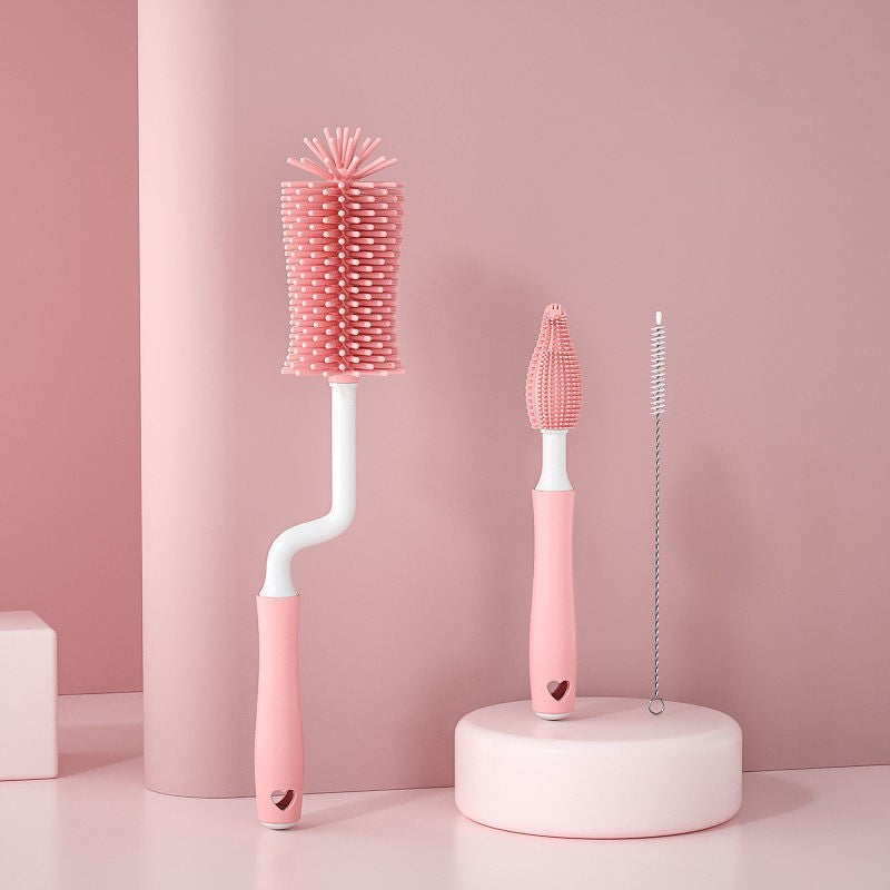 Baby bottle brush handle showing ergonomic grip and drain hole