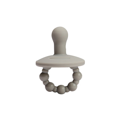 One piece pacifier held up to show smooth silicone shield