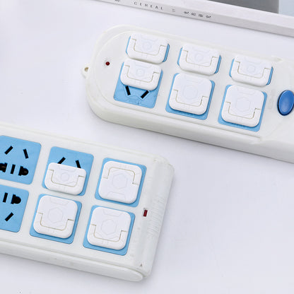 Childproof outlet covers on wall socket